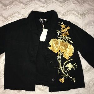 Black jean jacket with embroidered flower
